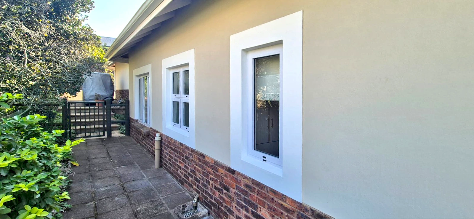 Completed Pro Aluminium installation of Alsysco Sash 42 windows, House Kilburn patio elevation